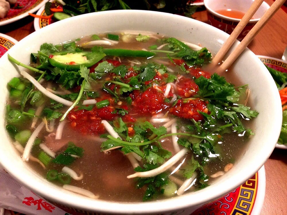 Pho with rare beef, herbs and chili